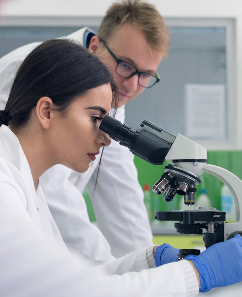 Fat and moisture encapsulation for alternative protein products 7 Lab partners looking in microscope